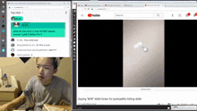 a man is sitting at a table in front of a computer screen with a youtube page open
