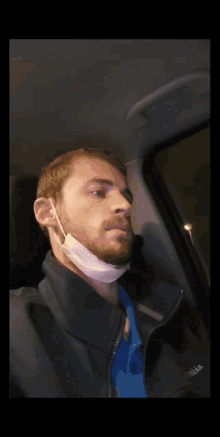 a blurry photo of a man wearing a face mask