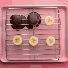 a pink tray with sliced bananas and chocolate balls on it