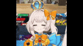 a cartoon girl with a crown on her head is smiling .