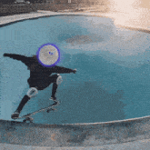 a person riding a skateboard in a pool with a smiley face in the middle