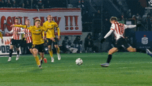 a soccer game is being played in front of a banner that says " bank polska "