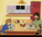 a boy and a girl are sitting at a table with plates of food