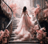 a woman in a long pink dress is walking down a set of stairs surrounded by pink flowers