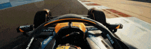 a close up of a race car with a steering wheel that says fxpro