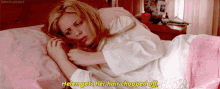 a woman laying on a bed with the words helen gets her hair chopped off below her