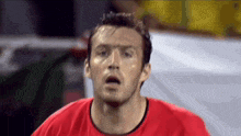 a close up of a man 's face with his mouth open