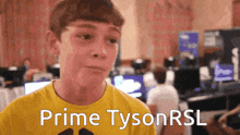 a boy wearing a yellow shirt that says prime tysonrsl