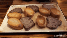 a tray of food with the words made in animatica on the bottom