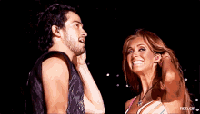 a man and a woman are smiling and looking at each other with rbd.gif at the bottom of the image