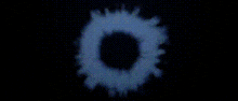 a computer generated image of a blue light coming out of a hole in the ground .