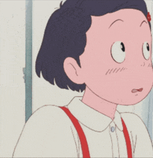 a close up of a girl 's face with a serious look on her face