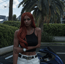 a woman with red hair is standing in front of a blue motorcycle
