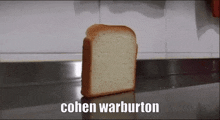 a slice of bread is sitting on a counter with the words cohen warburton written below it