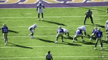 a football player with the number 37 on his jersey runs on the field