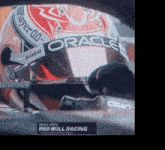 a race car driver is wearing a helmet that says oracle