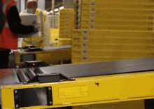 a yellow conveyor belt with a label on it that says ' t ' on it
