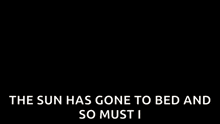 a group of people are dancing in a room with the words `` the sun has gone to bed and so must i '' above them .