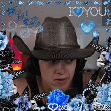 a man wearing a cowboy hat and headphones is surrounded by blue roses and hearts and says i love you