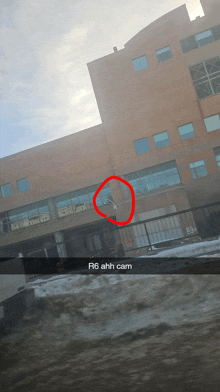 a building with a red circle around it that says r6 ahh cam on it