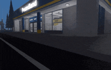 a poundland store at night with a sale sign