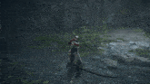a person is holding a sword in a video game and a sword is flying through the air .