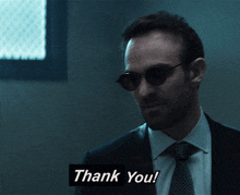a man wearing sunglasses says thank you