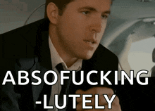 a man in a suit says absofucking -lutely