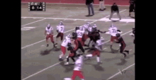 a football game is being played on a field with the score 8-14
