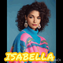 a woman in a pink and blue sweater with the name isabella written in yellow