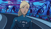 a woman in a superman costume stands on a street