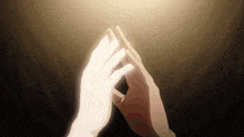 a couple of hands reaching out towards each other in the dark