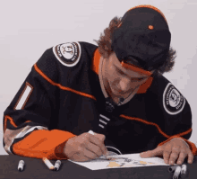 a hockey player with the number 1 on his jersey is drawing