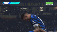 a soccer game is being played in a stadium with a banner that says la beneamata