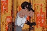 a man in a white tank top is standing in front of a yellow wall with chinese writing on it
