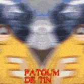 a blurred image of a person 's face with the words fatgum de tin written in red