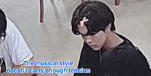 the musical style does n't carry enough tension is written above a person 's head
