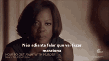 an ad for how to get away with murder shows a woman talking into a microphone