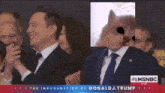 a man in a suit and tie is standing in front of a doge meme .