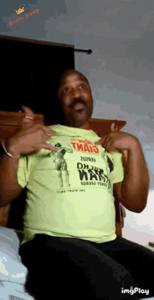 a man wearing a yellow shirt that says ' dirty maid '