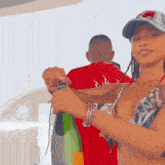 a woman in a bikini is holding a bottle of wine