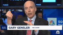 a man in a suit and tie is sitting in a sec chair at cnbc .