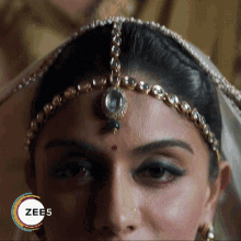 a close up of a woman 's face with a zee5 logo on the bottom