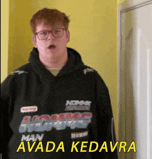 a man wearing a hoodie that says man avada kedavra on it