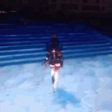 a blurry picture of a person walking down stairs