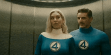 a man and a woman standing next to each other wearing fantastic four costumes