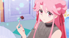 a girl with pink hair is holding a fork with a piece of food on it