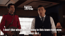 two men are standing next to each other with the words " i don t like what 's happening to this town right now "