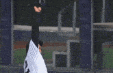 a baseball player wearing a jersey with the number 12 on it