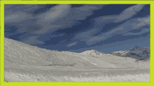 a picture of a snowy mountain with a yellow frame around it
